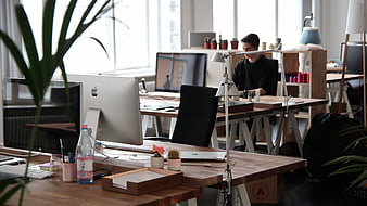 Modern Creative Office Workspace With Man Working At Desk