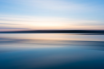 Abstract Long Exposure Blue Water Horizon at Sunset