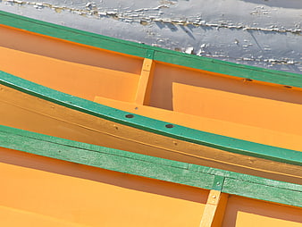 Close-up of Orange and Green Wooden Boat Hull