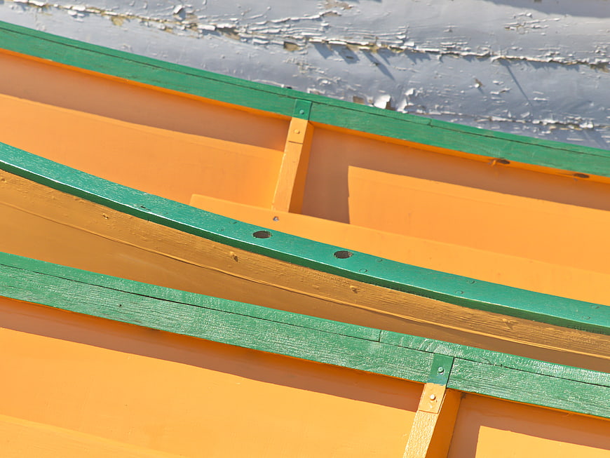 Close-up of Orange and Green Wooden Boat Hull