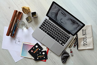 Digital Art Workspace with Laptop and Sketching Tools
