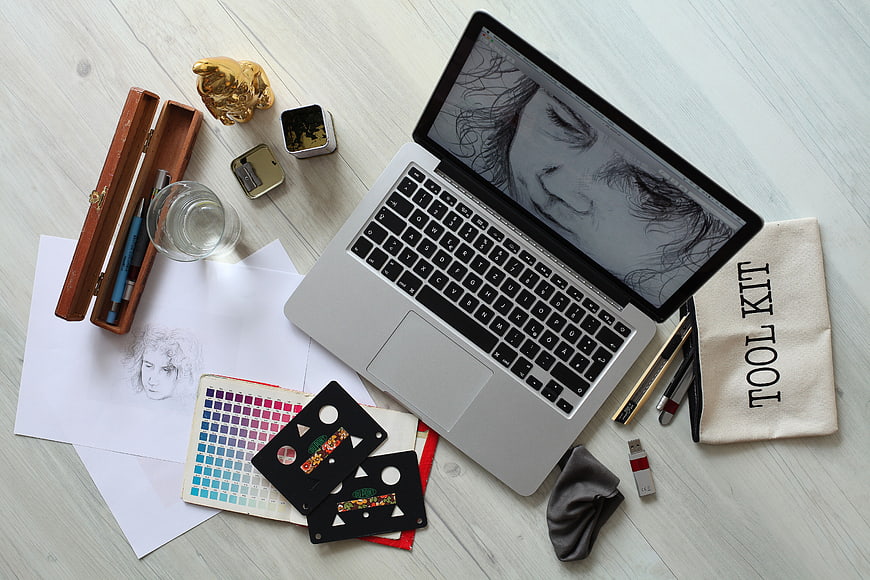 Digital Art Workspace with Laptop and Sketching Tools