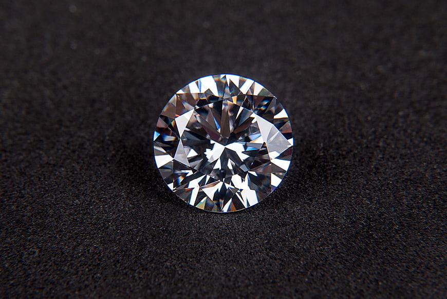 Brilliant Round Diamond on Dark Textured Background