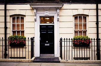 Classic London Townhouse with Black Door and Flower Boxes