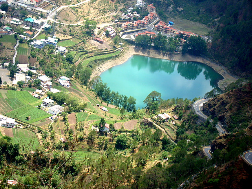 Aerial View of Turquoise Mountain Lake and Village