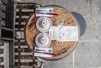 Top view of rustic cafe table set for two in Paris
