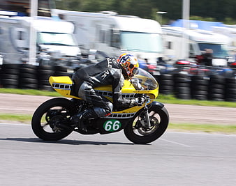 Yellow Racing Motorcycle Leaning on Track