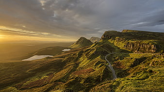 Winding Mountain Road at Golden Hour in Scottish Highlands