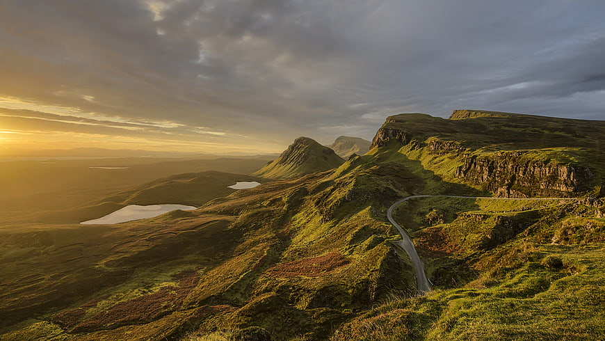 Winding Mountain Road at Golden Hour in Scottish Highlands