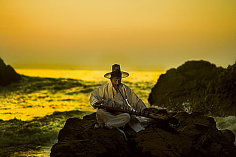 Korean Scholar Playing Gayageum on Rocky Coast at Sunset