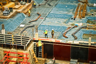 Construction workers on a building site with tilt-shift effect