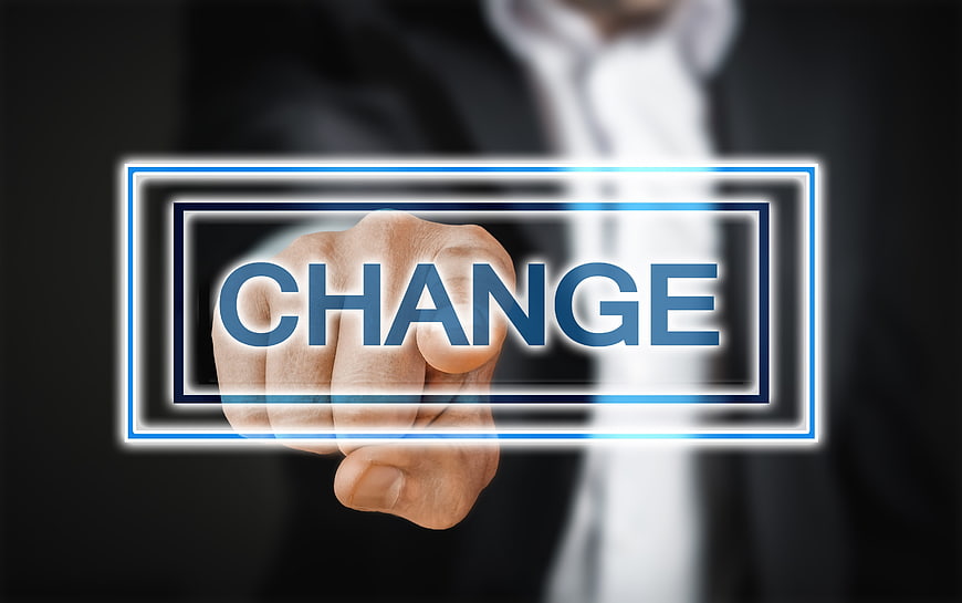 Businessman Hand Pressing Change Button on Digital Interface