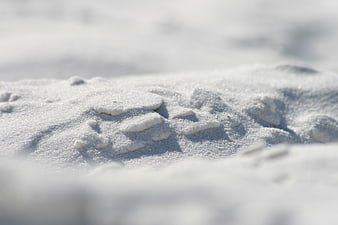 Close-up of white sand texture with natural patterns