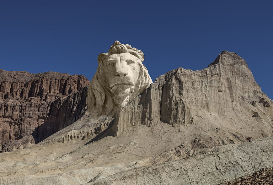 Lion Rock Sculpture in Arid Mountain Landscape