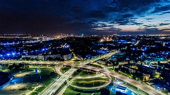 Aerial Night View of Riga Highway Interchange and City Lights
