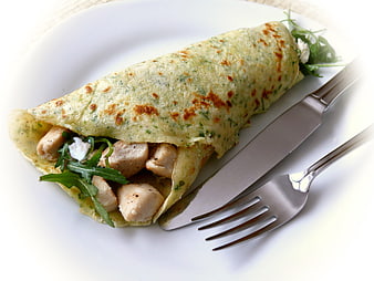 Herb Crepe with Chicken and Arugula on White Plate