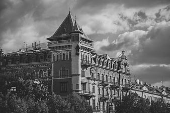 Black and White Historic Building with Dramatic Clouds