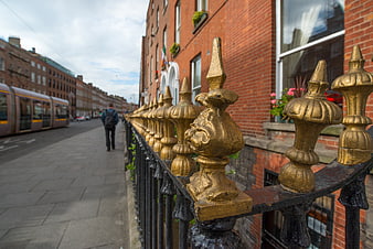Golden Railing Detail on Dublin Street with Tram