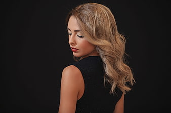 Studio Portrait of Woman with Wavy Blonde Hair