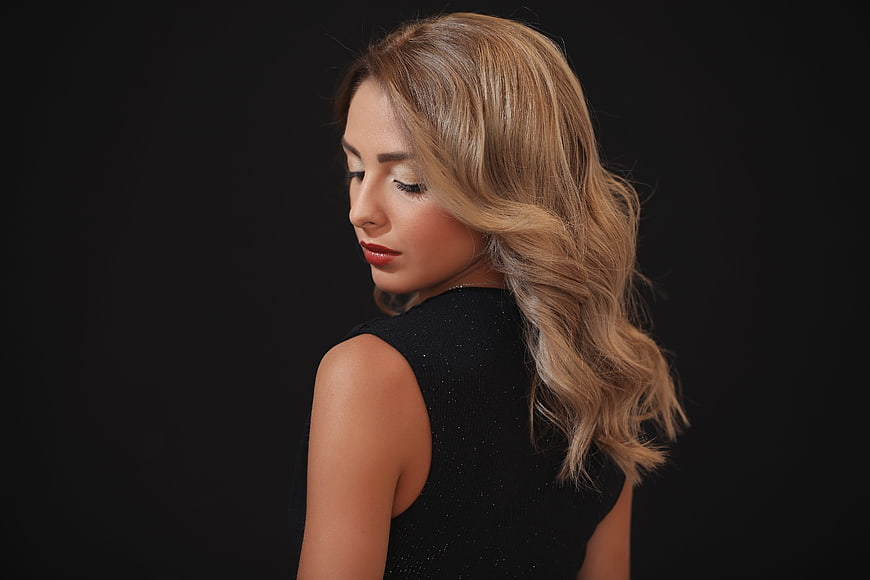 Studio Portrait of Woman with Wavy Blonde Hair
