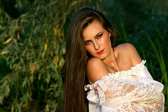 Portrait of Woman in White Lace Dress Outdoors