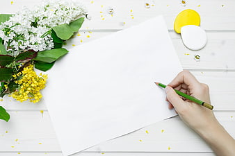 Hand writing on paper with spring flowers and pastel paints