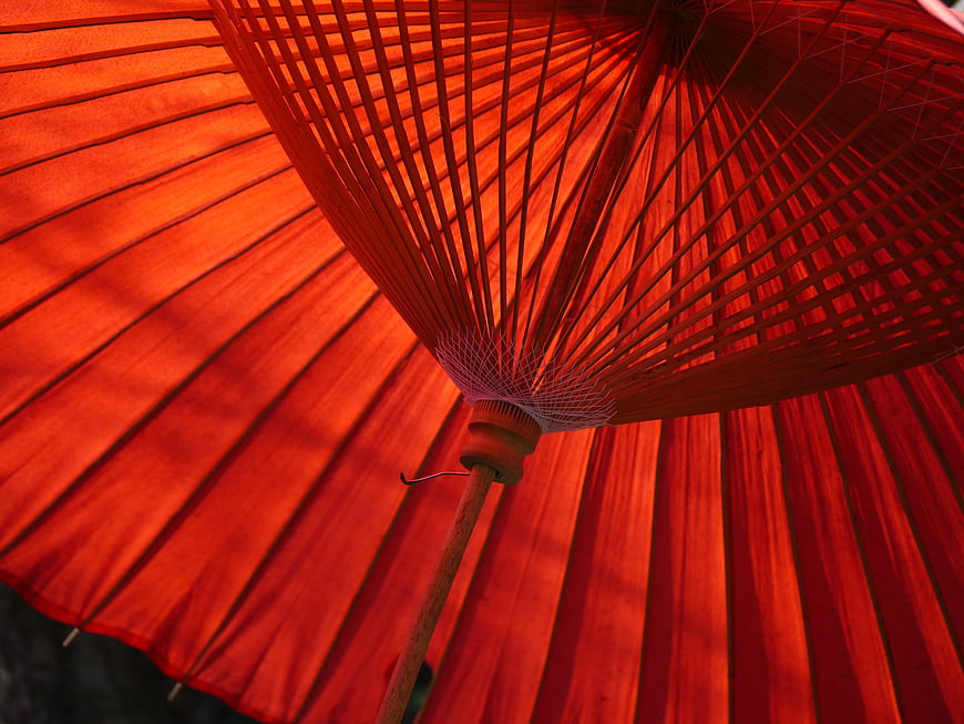 Close-up of traditional red Japanese paper parasol underside