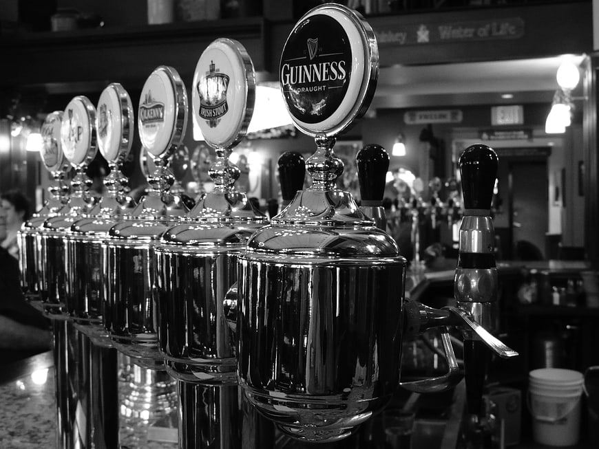 Row of polished beer taps in a pub