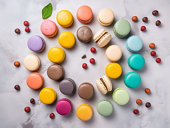 Colorful macarons arranged on a marble background