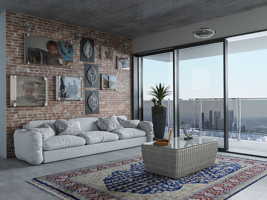 Modern living room with brick wall and city view