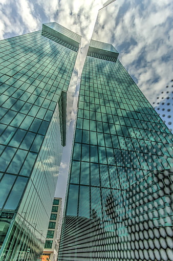 Low angle view of modern green glass skyscrapers