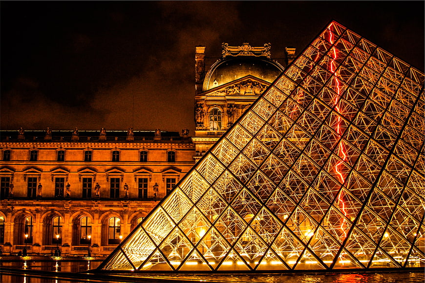 Illuminated Louvre Pyramid at Night in Paris