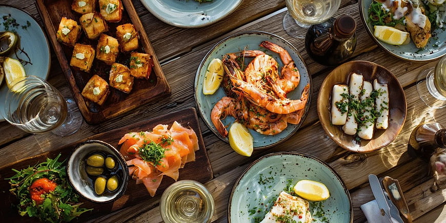 Overhead View of Rustic Seafood Feast on Wooden Table