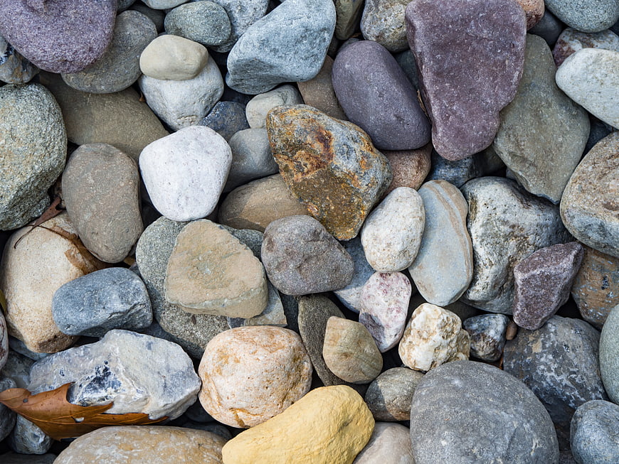 Close-up of smooth multicolored river stones and pebbles