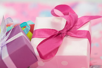 Colorful Gift Boxes with Ribbons on Blurred Background