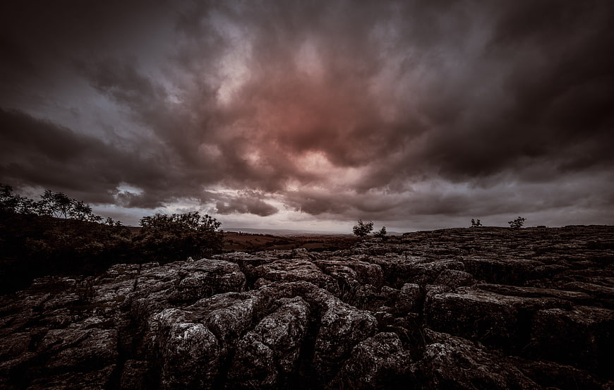 Dramatic moody limestone pavement landscape under stormy clouds