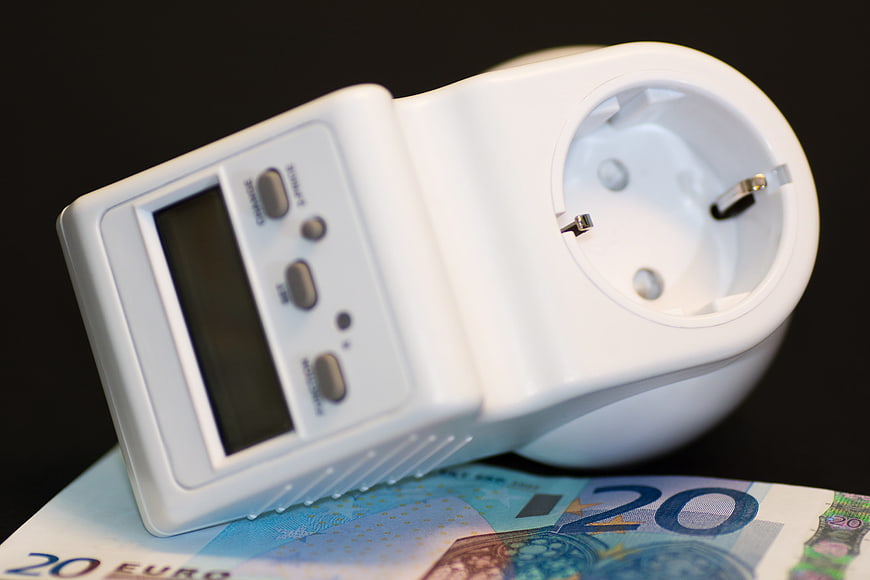 White energy meter on euro banknotes for electricity cost concept