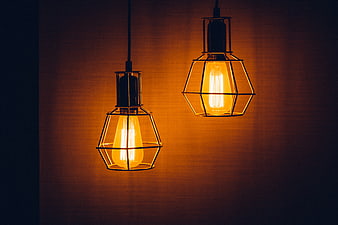 Two vintage industrial pendant lights with Edison bulbs
