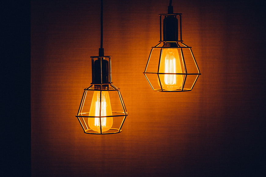 Two vintage industrial pendant lights with Edison bulbs
