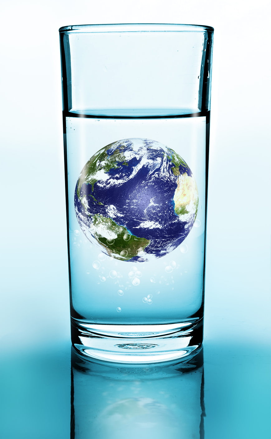 Glass of Water with Earth Globe Inside Concept