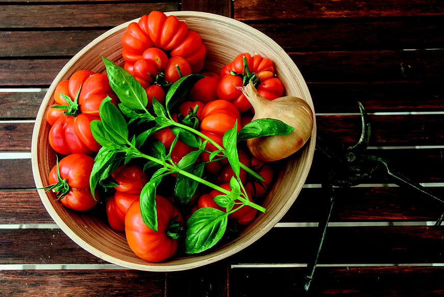Fresh Heirloom Tomatoes, Basil, and Onion in Wooden Bowl