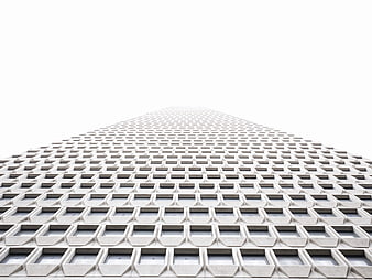 Low angle view of modern skyscraper facade with geometric pattern