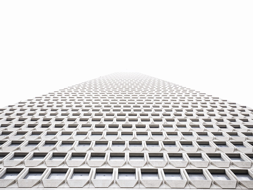 Low angle view of modern skyscraper facade with geometric pattern
