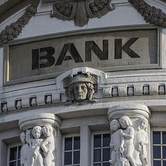 Classical Bank Building Facade with Stone Sculptures