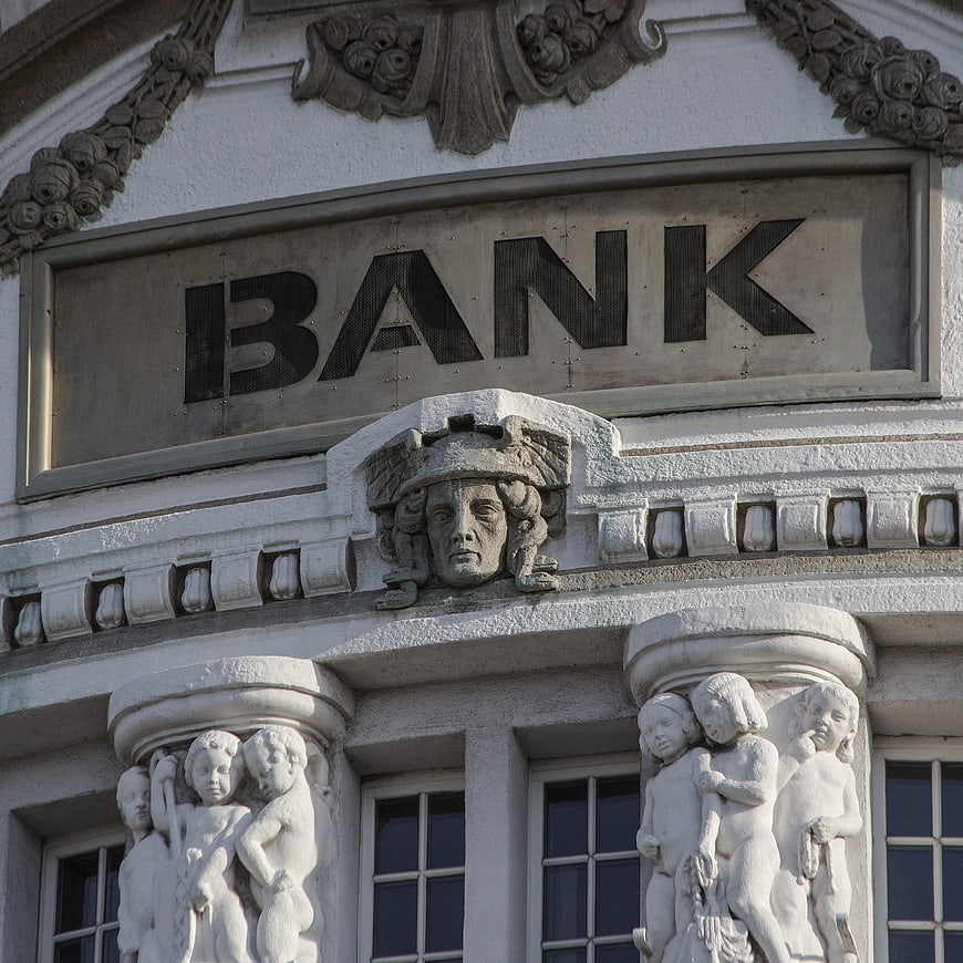 Classical Bank Building Facade with Stone Sculptures