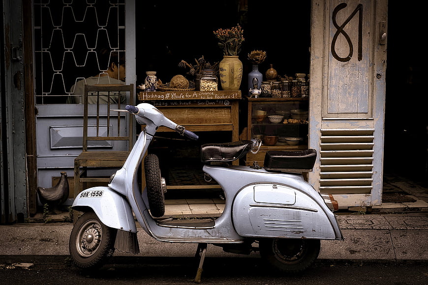 Vintage Silver Scooter Parked Outside Rustic Vietnamese Street Shop