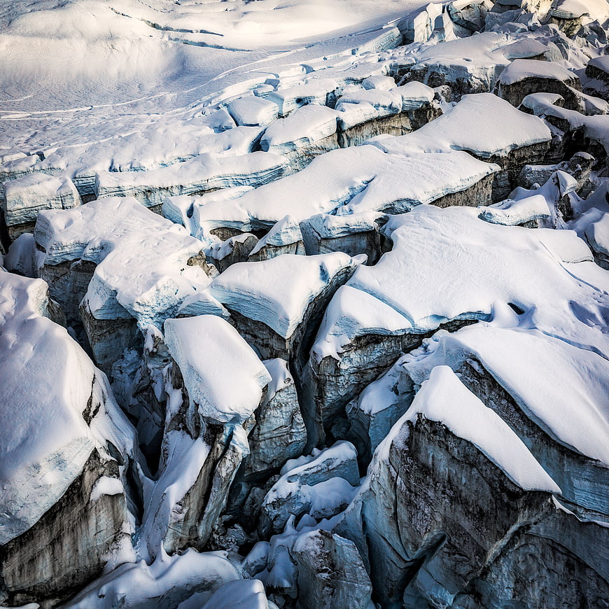Aerial View of Fractured Snow-Covered Glacier Landscape