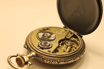 Vintage Pocket Watch with Exposed Gears and Mechanism