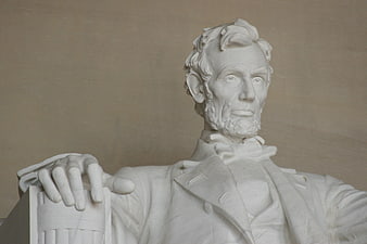 White marble bust of Abraham Lincoln with hand on architectural column