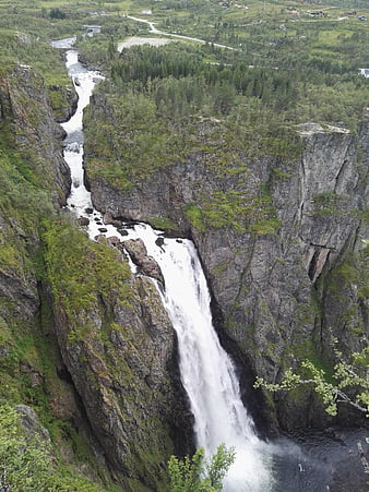 High Angle View of Powerful Waterfall in Green Norwegian Canyon